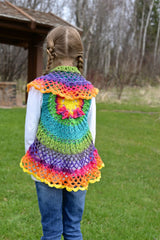 Girl wearing a colorful crocheted mandala circular vest outdoors thumbnail