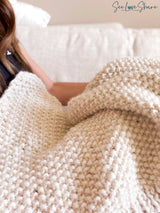 whipped cream colored knitted blanket highlighting seed stitch texture thumbnail