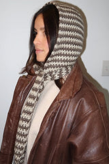 Woman in leather jacket wearing scarf/hood thumbnail