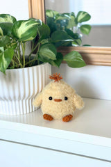 Fluffy chick stuffed animal on a shelf thumbnail