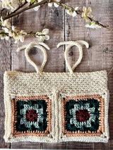 handmade crochet hearthside book sleeve on a wooden surface thumbnail