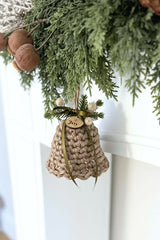 crocheted holiday bell ornament door hanger with green ribbon and evergreen sprigs thumbnail