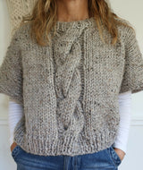 Knitted Poncho Worn By A Woman thumbnail