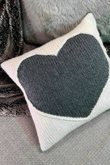 pillow with a heart and 4 buttons on a couch thumbnail