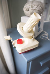 yarn ball winder with yarn and box in the background thumbnail