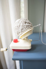 Yarn ball winder attached to a dresser winding medium weight yarn thumbnail