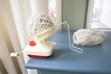 Yarn ball winder attached to a dresser winding medium weight yarn thumbnail