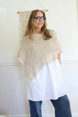 Knitted Poncho Worn By A Woman thumbnail