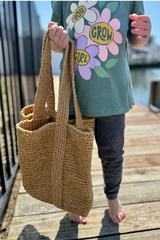 child holding tote bag thumbnail