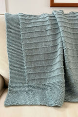 knit blanket on a couch thumbnail