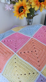Crochet Blanket Beside Flower thumbnail