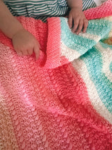 Crochet Blanket Held By A Child thumbnail