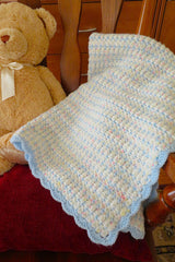 baby blanket folded on chair thumbnail
