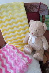 Crochet Baby Blankets Beside A Teddy Bear  thumbnail