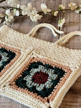 handmade crochet hearthside book sleeve on a wooden surface thumbnail
