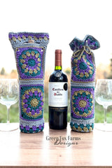 wine glasses, wine bags, and a bottle of wine on a table  thumbnail