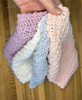 handmade lavender crochet spa set including a washcloth, lather sack and facial scrubby thumbnail