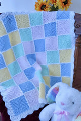 Baby blanket draped over a chair thumbnail