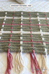crocheted sage green tartan plaid throw blanket featuring cream and rose woven vertical stripes and fringe tassel ends thumbnail