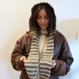 Woman in leather jacket wearing scarf/hood thumbnail