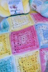 crochet granny square blanket with 2 skeins of ice cream yarn thumbnail