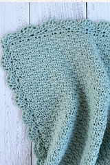 Crochet blanket on a wood background thumbnail