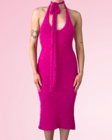 Woman wearing hot pink dress made with fuzzy yarn on pink background thumbnail