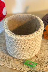 handmade crochet acorn on a wooden table thumbnail