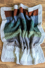 multicolor blanket on the floor thumbnail