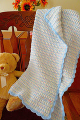 baby blanket draped over chair next to teddy bear thumbnail