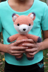 child holding fox stuffed animal thumbnail