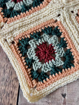 handmade crochet hearthside book sleeve on a wooden surface thumbnail