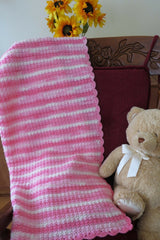Crochet Blanket Beside A Teddy Bear thumbnail