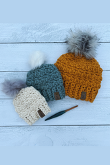 3 sizes of hats with a crochet hook on a wood background thumbnail