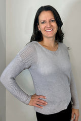 woman posing with hand on hip in knit sweater thumbnail