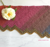 scarf on marble background with flower on top thumbnail