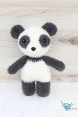 stuffed panda with wood background thumbnail