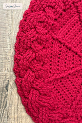 close up of handmade red and white cable braid crochet Christmas tree skirt thumbnail