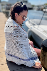 Gray and blue shawl draped over womans shoulders from the side thumbnail