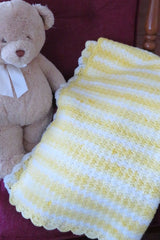 Crochet Blanket Beside A Teddy Bear thumbnail
