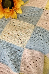 Crochet Blanket Beside A Sun Flower thumbnail