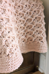 close-up of pink crochet blanket thumbnail