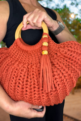 woman holding purse thumbnail