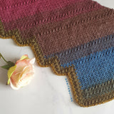 scarf on marble background with flower on top thumbnail