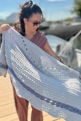 Woman holding gray and blue shawl thumbnail