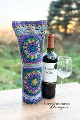 wine glass, wine bag, and a bottle of wine on a table  thumbnail