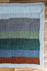 striped blanket on wood background thumbnail