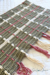 crocheted sage green tartan plaid throw blanket featuring cream and rose woven vertical stripes and fringe tassel ends thumbnail