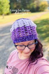 elixir beanie featuring purple ombre mandala yarn crocheted in a textured stitch pattern on model thumbnail