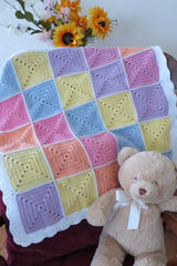 Crochet Blanket Beside Teddy Bear thumbnail
